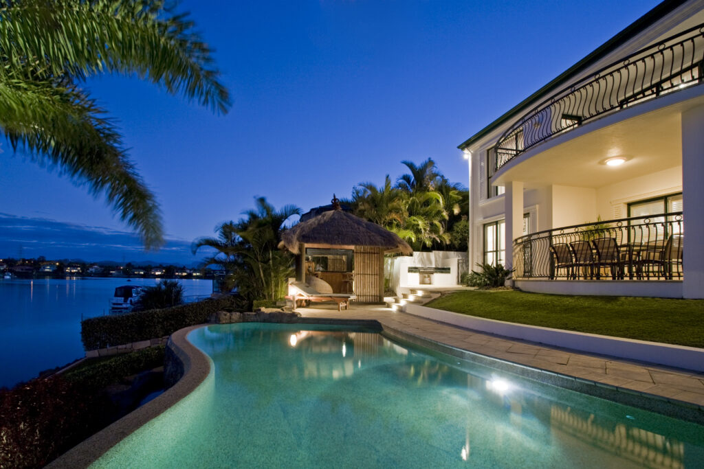 Image of a pool in front of a house after a Housekeeping Gold Coast from Land Based